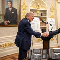 <p>President Donald Trump shakes hands with Apple CEO Tim Cook at the White House on August 6, 2025.</p>