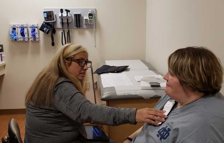 Program manager Dana Dolce, APN, and Mary during a visit to JSUMC to calibrate her DBS system.
  
