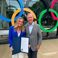 <p>Ali Truwit with Connecticut Gov. Ned Lamont at a send-off ceremony in Darien on Friday, Aug. 16.&nbsp;</p>