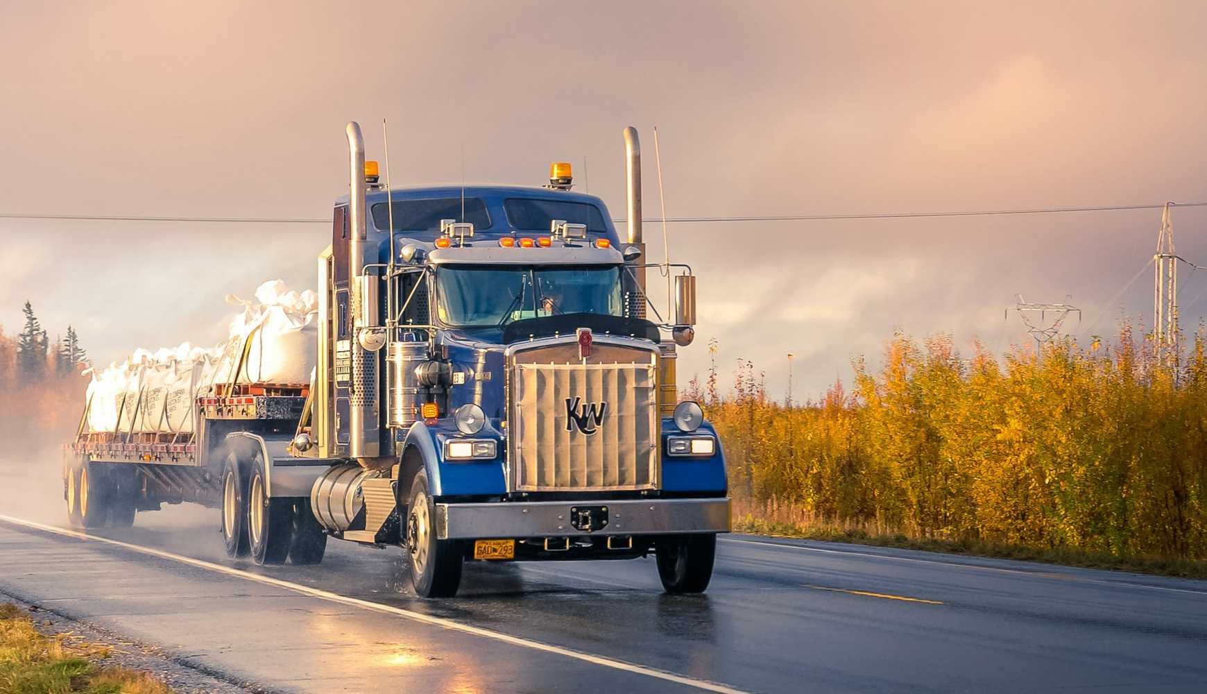 
A tractor-trailer on a road in Alaska.
  

